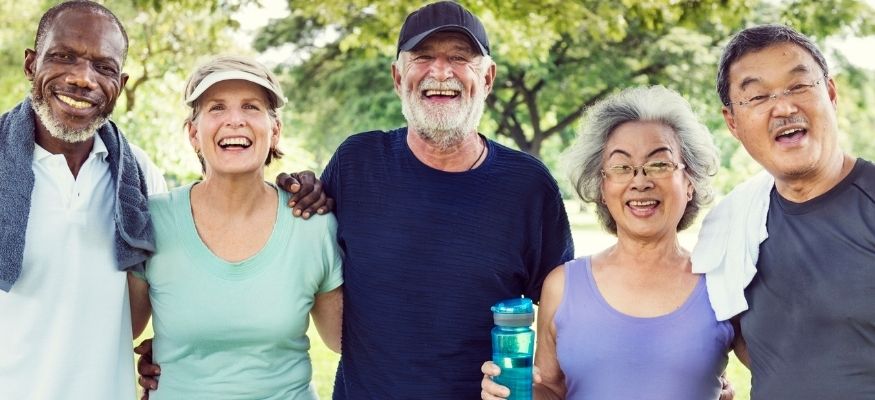 smiling senior citizens outside