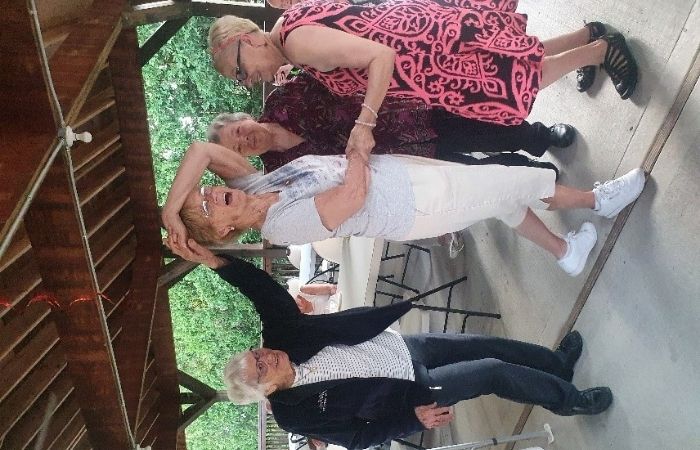 women dancing in a gazebo