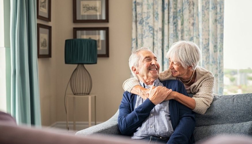 older adult couple embracing