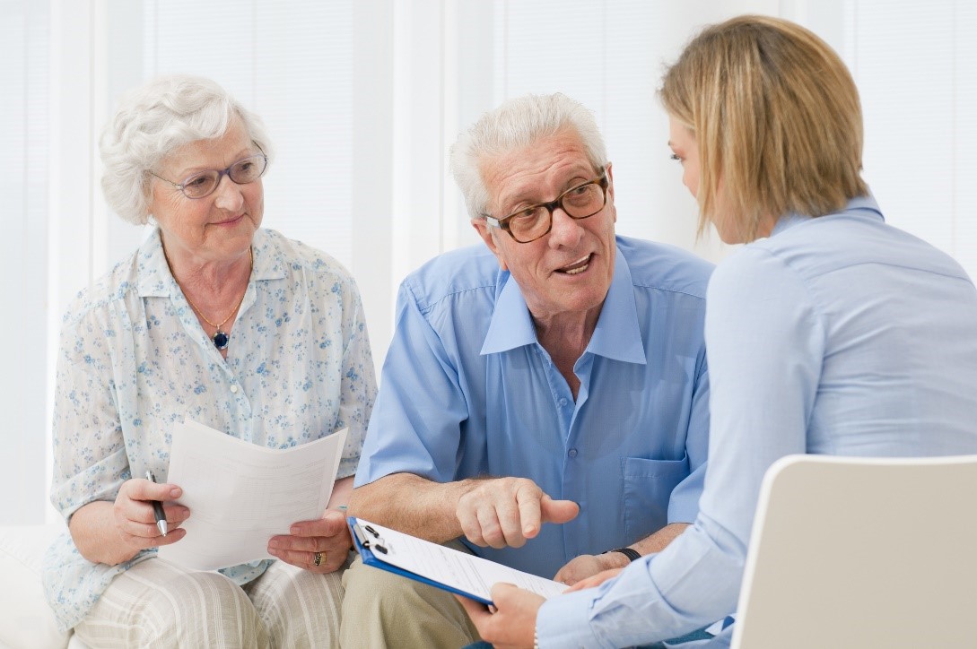 senior couple meeting with an advisor