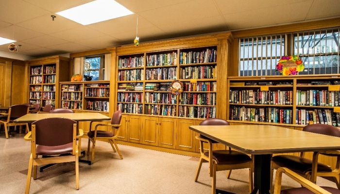 book shelves and a few empty tables for reading