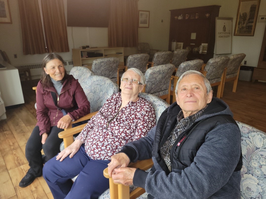 three senior friends sitting together