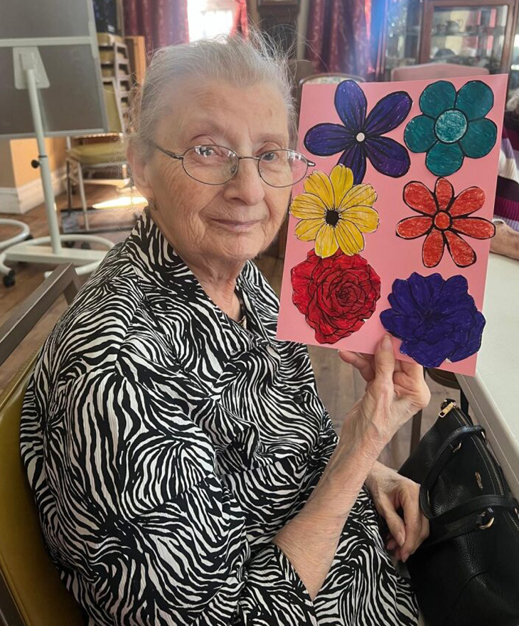 woman holding flower craft